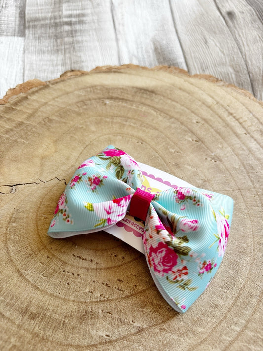 Blue and pink floral single handmade hair bow close-up by Buttons and Bows