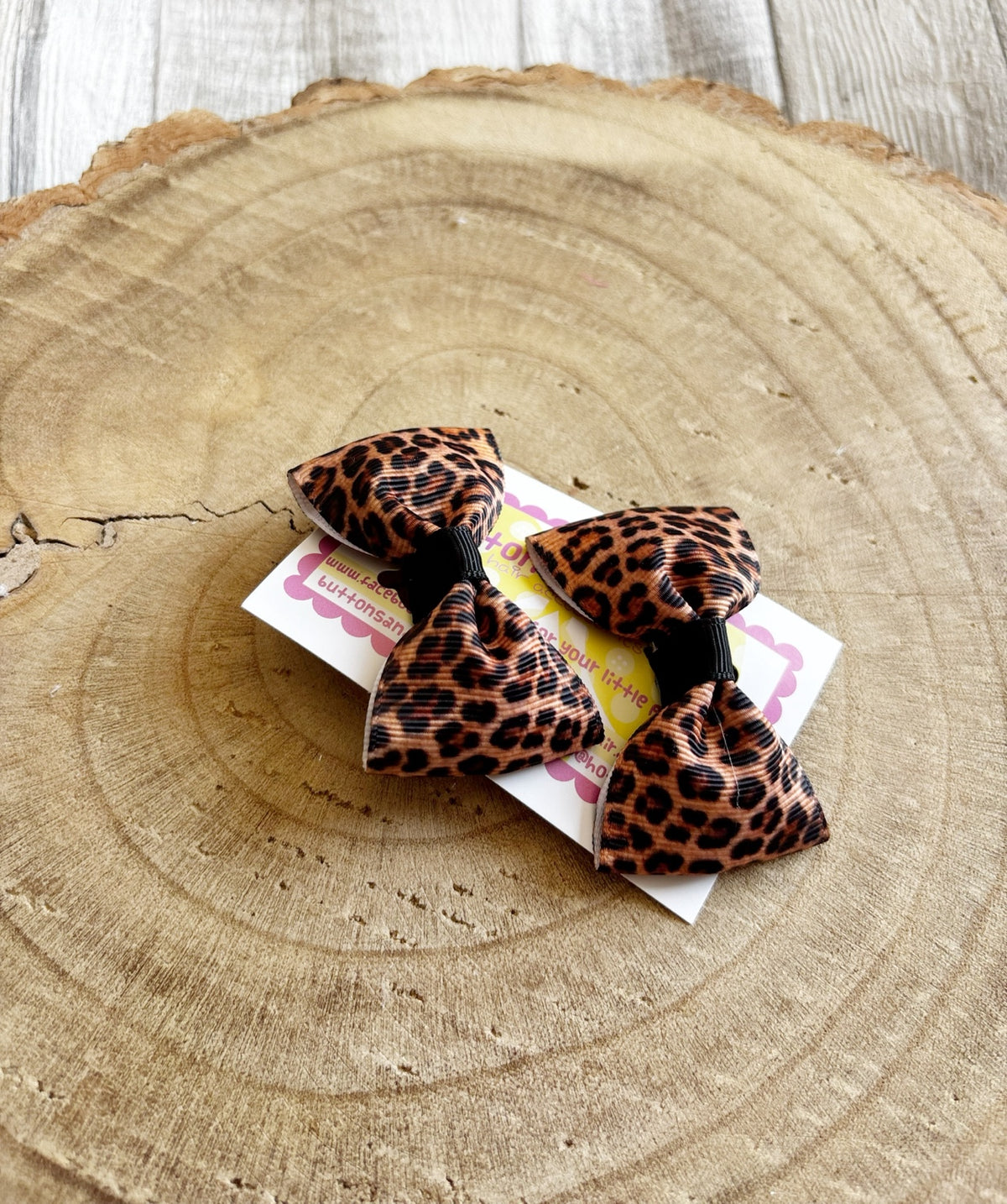 Leopard print handmade hair bow set with black centres by Buttons and Bows