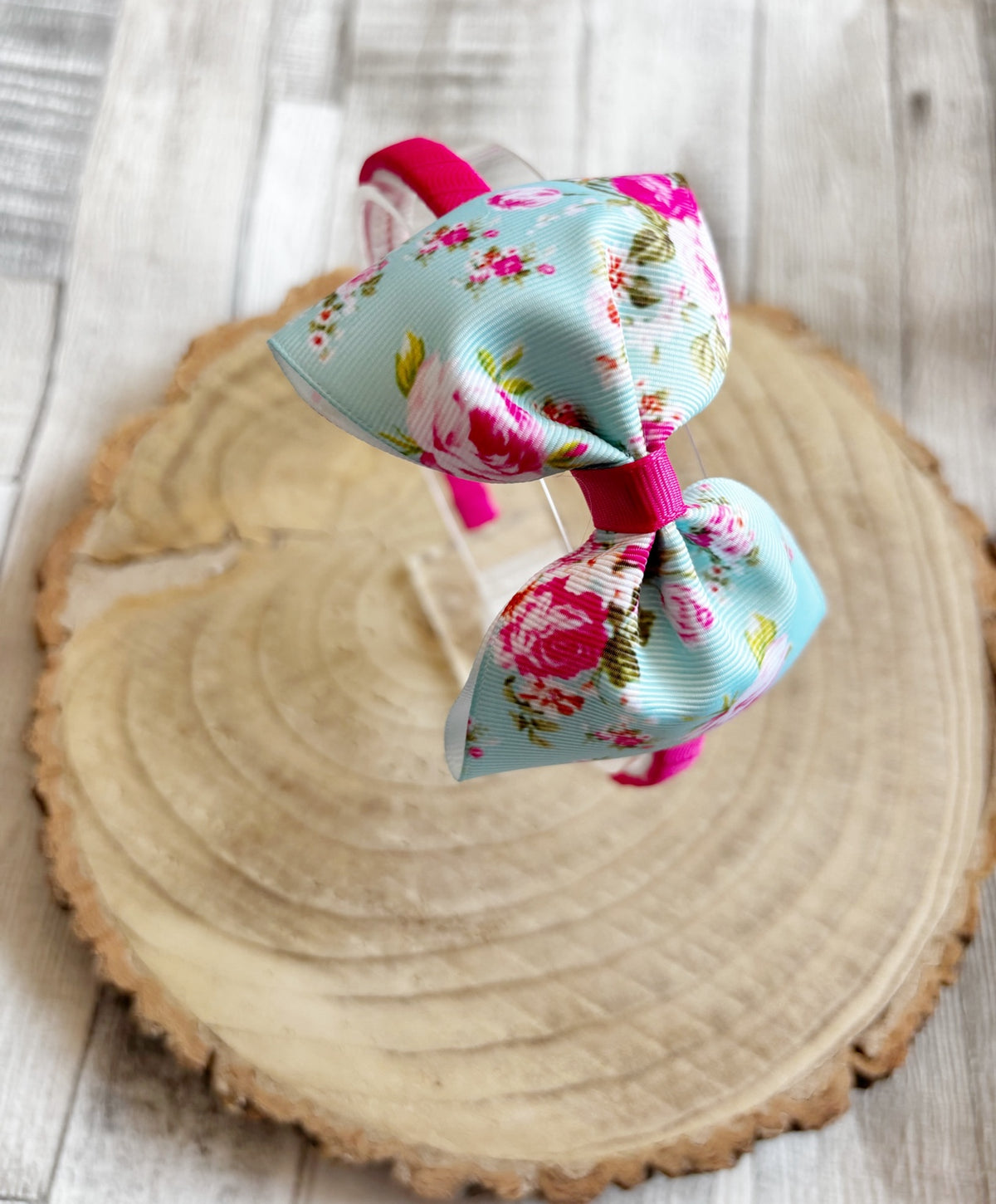 Close-up blue floral bow thin hairband handmade by Buttons and Bows