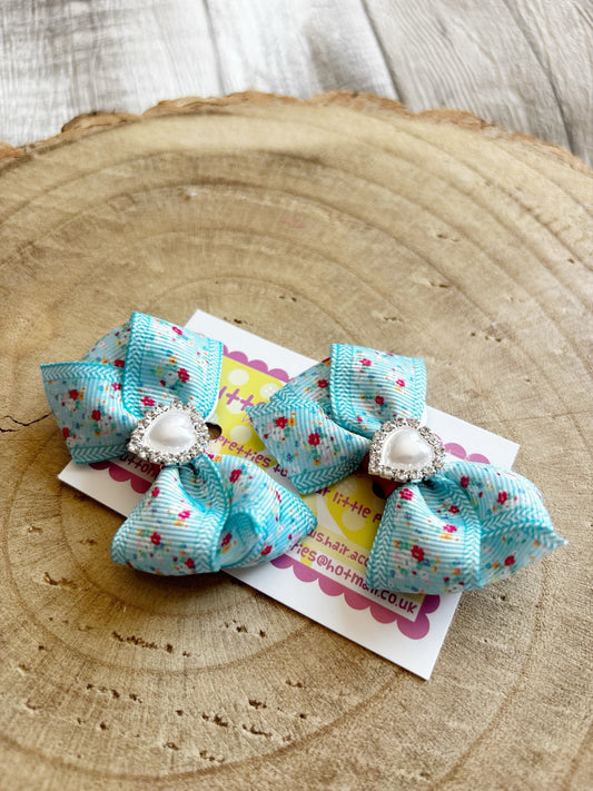 Blue floral handmade hair bow set with pearl heart centres by Buttons and Bows