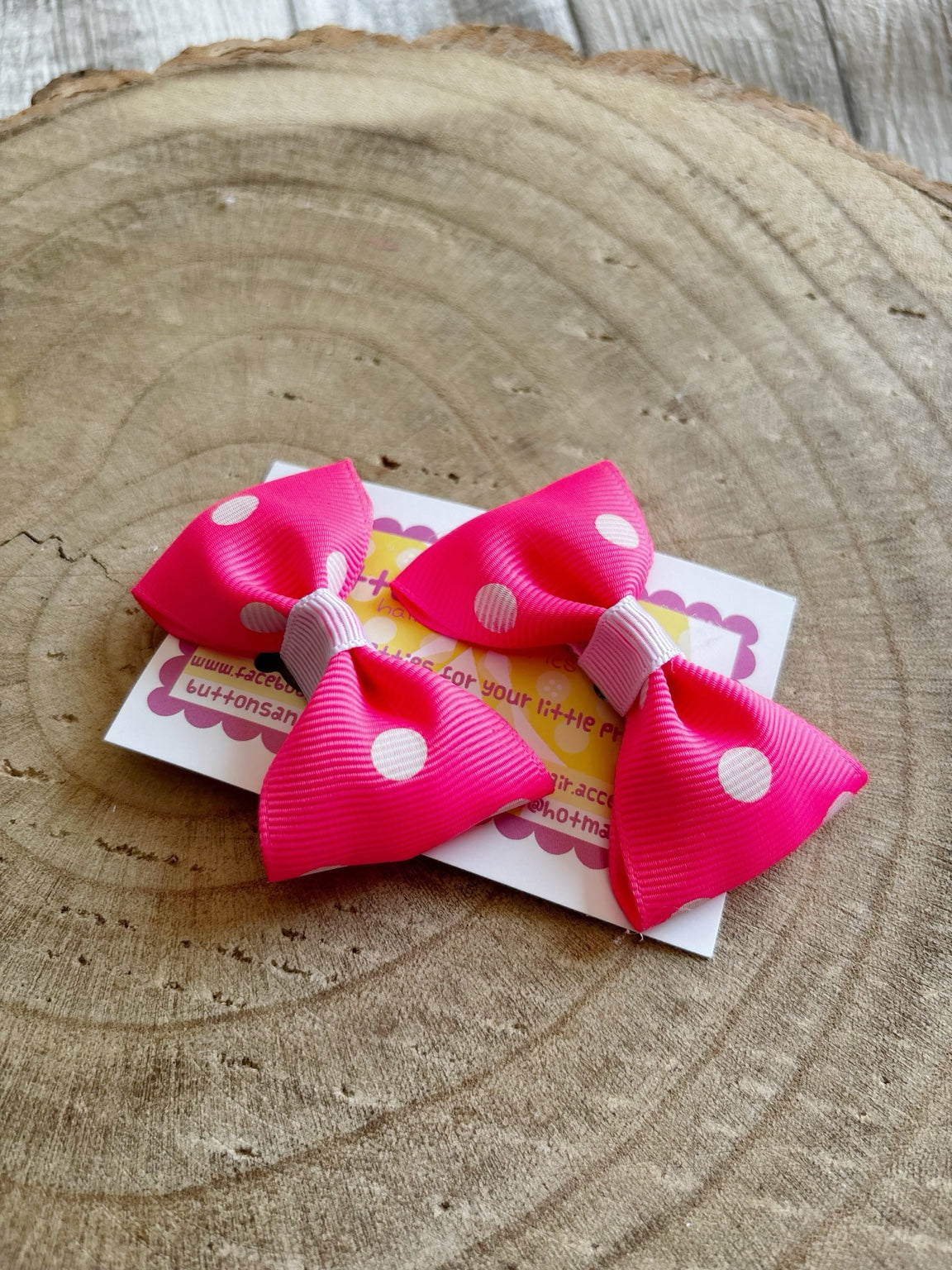 Bright pink and white polka dot handmade hair bow set by Buttons and Bows