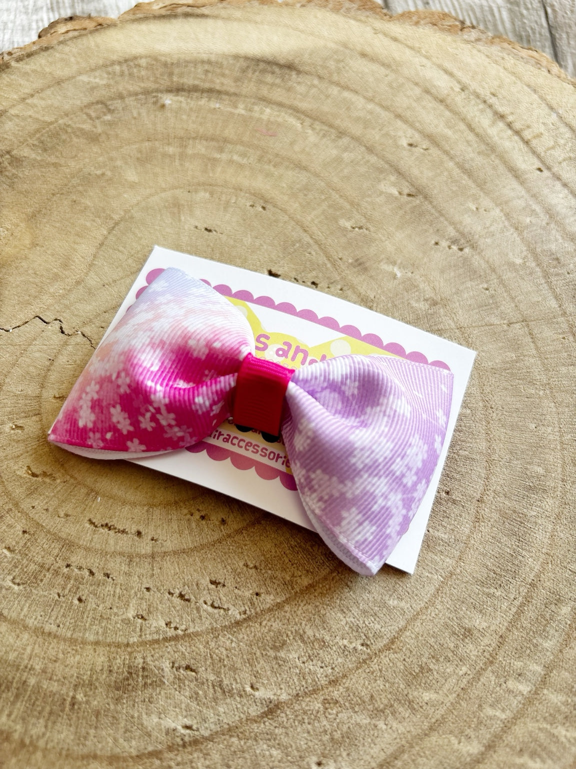 Close-up pink and purple floral single hair bow by Buttons and Bows
