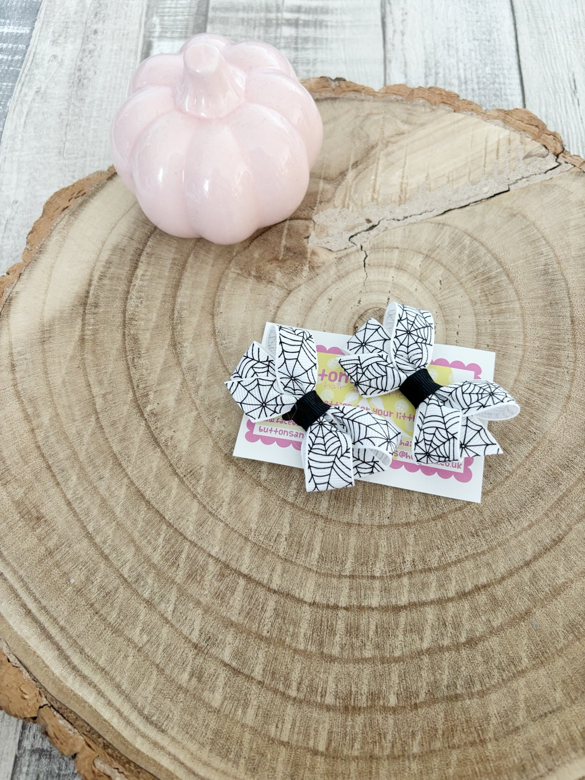 White spiderweb Halloween bow set handmade by Buttons and Bows