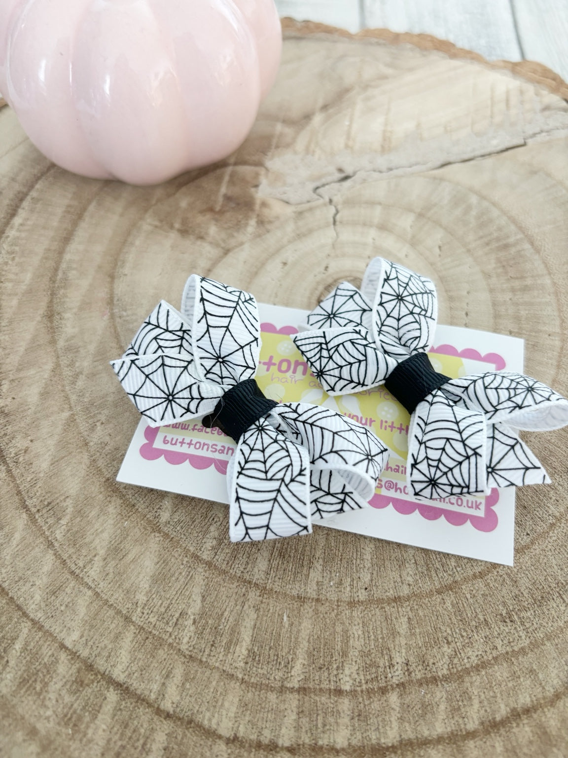 White spiderweb Halloween bow set handmade by Buttons and Bows view 2