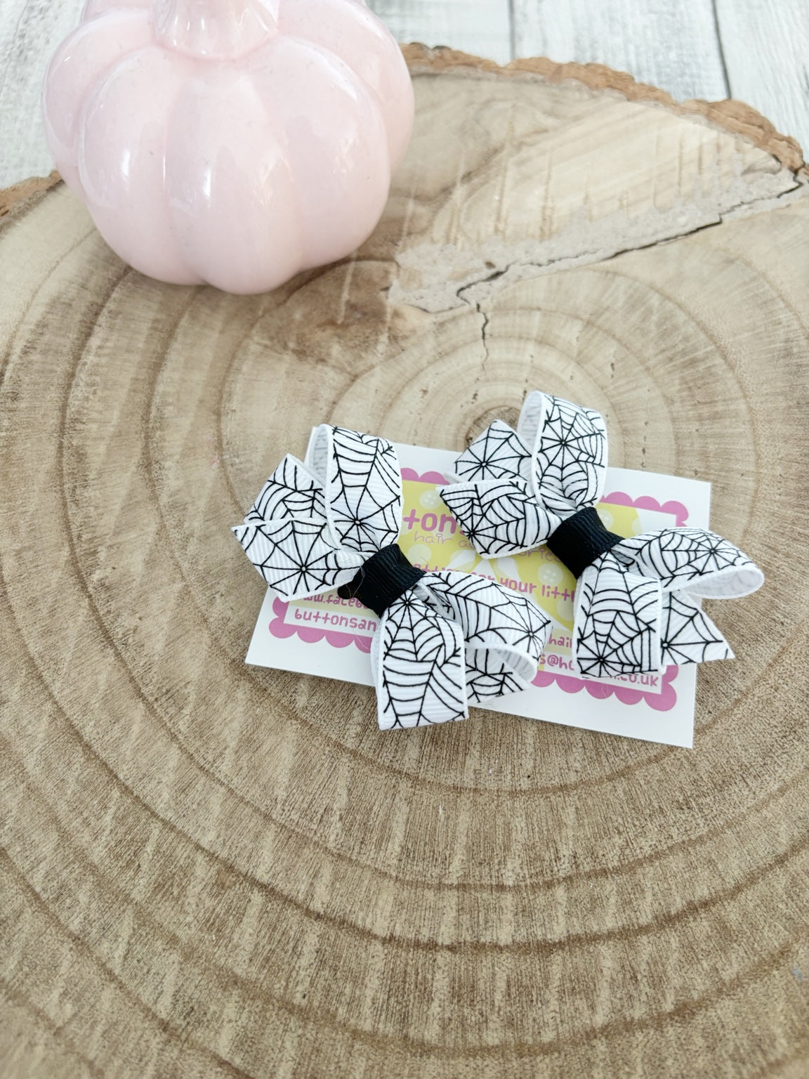 White spiderweb Halloween bow set handmade by Buttons and Bows view 3